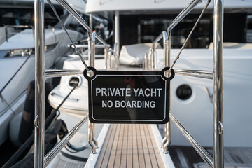 Private Yacht No Entry sign of a superyacht on a dock 