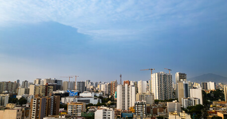 Fototapeta premium Aerial view of a modern district of the city of lima on a sunny summer afternoon with a beautiful clear blue sky