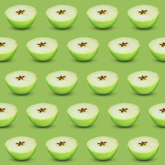 Halves of fresh apple on light green background, seamless pattern