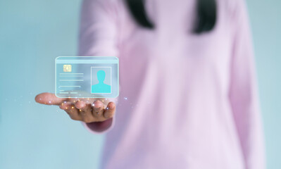 Woman is holding digital identification holographic ID card