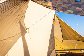 Fabric sunshade, regular canvas, and camouflage on a military base.