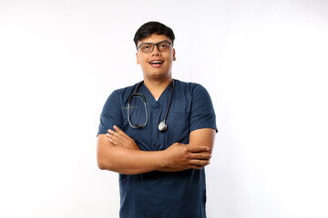 A male nurse is standing wearing scrubs and a stethoscope. He is smiling and looking camera.Portrait of young male nurse isolated on white