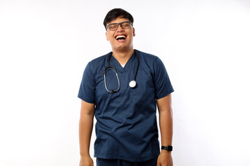 Carefree male asian nurse in scrubs, intern having fun, laughing happy. Doctor on lunch break chuckle and talking to coworkers