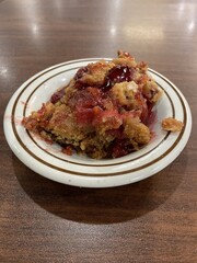 A bowl full of fresh cherry cobbler