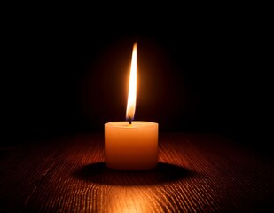 Candlelight Vigil: A single candle burns brightly against a dark background, its soft glow offering a sense of peace and remembrance.  