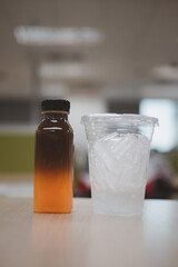 Drinks for a relaxing afternoon at the office. Black coffee mixed with sweet orange juice placed in the iced cup. Creative coffee.