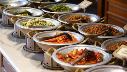 Indonesia tradisional dishes served on a clay anglos. Anglo is Indonesia tradisional stove.