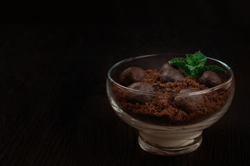 Chocolate dessert of cookies with pieces of chocolate colored in Mocha mousse color of 2025