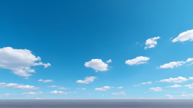 Clear blue sky with fluffy white clouds.