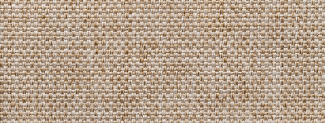 Texture beige background from woven textile material with wicker pattern, macro. Structure vintage light brown fabric