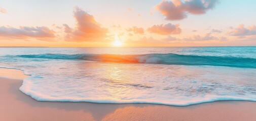 Fototapeta premium A serene beach scene at sunset, featuring gentle waves lapping at the shore under a colorful sky, creating a tranquil atmosphere.