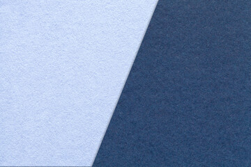 Texture craft navy blue and sky paper background, half two colors, macro. Structure vintage denim cardboard.