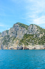 coastal landscape with blue sea and beautiful cliffs an mountains