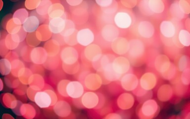 Beautiful bokeh effect creates a soft and vibrant background of pink and orange hues for artistic visuals