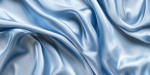 Abstract flowing silk fabric texture, beautiful draped shimmering satin background in powder blue