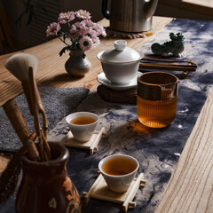 The Elegant Traditional Tea Ceremony Setup with Beautiful Flowers and Utensils Involved