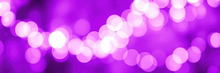 Purple bokeh lights create a magical atmosphere during an evening celebration in an urban setting