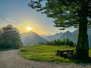 Hiking trail with sunrise view of majestic mountain peaks of Julian Alps, Val Saisera, Friuli...