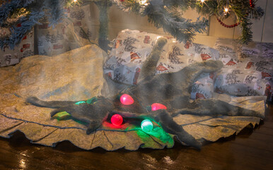 Smoking artificial cat fur under a Christmas tree