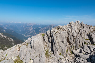 Scenic view of alpine valley Val Canale seen from top of Jof di Miezegnot. Surrounded by majestic...