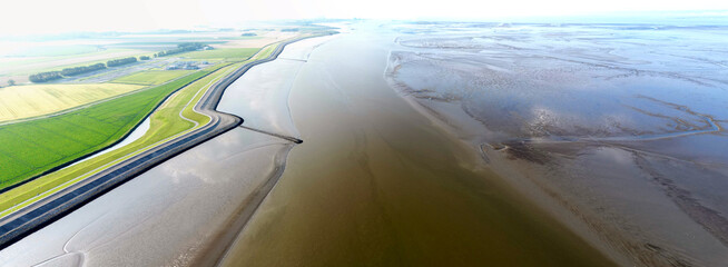 Aerial view of a tidal channel and mudflats near Termunterzijl, Groningen, The Netherlands