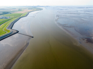 Aerial view of a tidal channel and mudflats near Termunterzijl, Groningen, The Netherlands