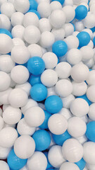 Blue and white plastic balls at kids indoor playground