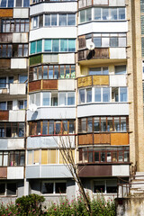 Soviet era architecture style of living district in Vilnius, Lithuania. Post-soviet urban architecture. Wall with windows and balconies.