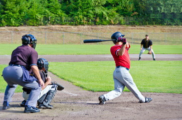 Baseball players playing the sport they love at a small stadium of the minor leagues