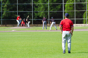 Baseball players playing the sport they love at a small stadium of the minor leagues
