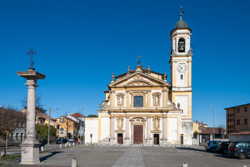 Obraz premium The main church of Gaggiano in Lombardy, a beautiful example of Romanesque architecture, features a charming façade and intricate details, standing as a peaceful center of faith in the village.