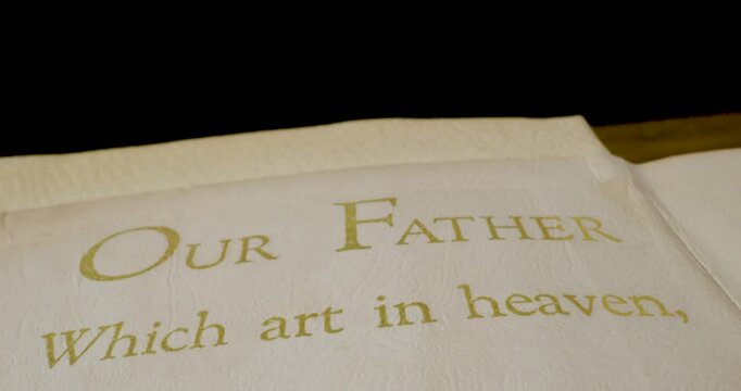 Holy Bible Beige Cover Our Father Which Art In Heaven Tilt Down Macro