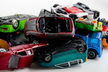 Fototapeta premium a group of small toy cars piled up in a heap
