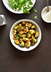Oven roasted zucchini with garlic and greens