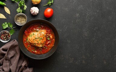 Baked chicken with tomato gravy and herbs