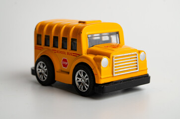 model of a small toy car made of plastic on a white background