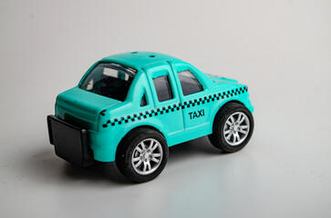 model of a small toy car made of plastic on a white background