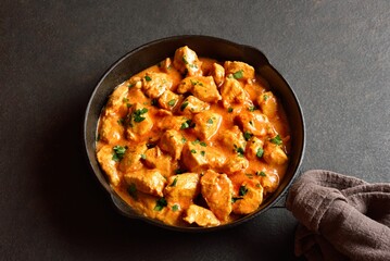 Delicious chicken tikka masala curry in cast iron pan
