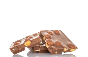 One bar of dark chocolate with hazelnuts, close-up, isolated on a white background.