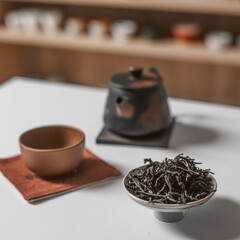 A beautifully arranged Elegant Tea Ceremony Setup featuring Delicate Tea Leaves and Pot