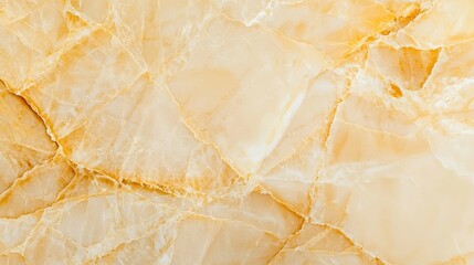 Fototapeta premium A smooth, light-colored marble surface featuring subtle veins and a warm, golden hue, perfect for elegant interiors.