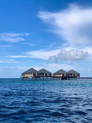 Water villa and resort in Maafushi island, Maldives - Sunny and beautiful holiday vacation in the Indian Ocean, surrounding by amazing crystal clear water and the sea and the beach 