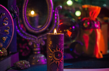 Candle burns on the altar, magic among candles, clean negative energy, magical concept, winter time	