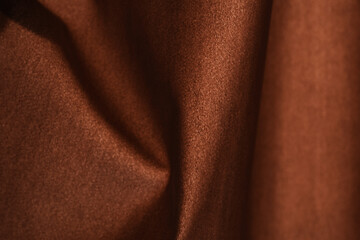 Brown silk curtains in the house near the window