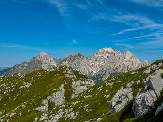 Scenic view of pristine rugged mountain peaks of Western Julian Alps, Italy, Europe. Wild hiking...