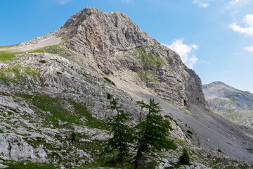 Scenic view of cloud covered rocky rugged mountain peak of Cima Dei Lasteri in majestic Brenta Dolomites, Trentino, Italy. Wanderlust in alpine wilderness. Hiking in pristine Italian Alps in summer