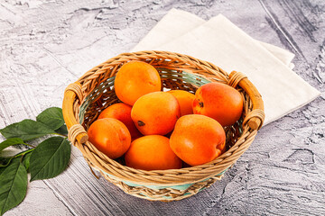 Raw ripe sweet apricots heap