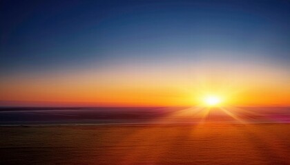 Golden Hour Horizon: A serene sunset paints the sky with vibrant hues of orange, red, and blue, casting a warm glow over the distant horizon.