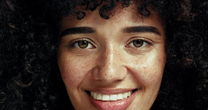 Hair, studio and face of woman with natural hairstyle for texture, healthy curls and wellness. Happy, smile and portrait of person for cosmetics, haircare products and shampoo treatment for salon