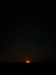 Rising moon with stars 